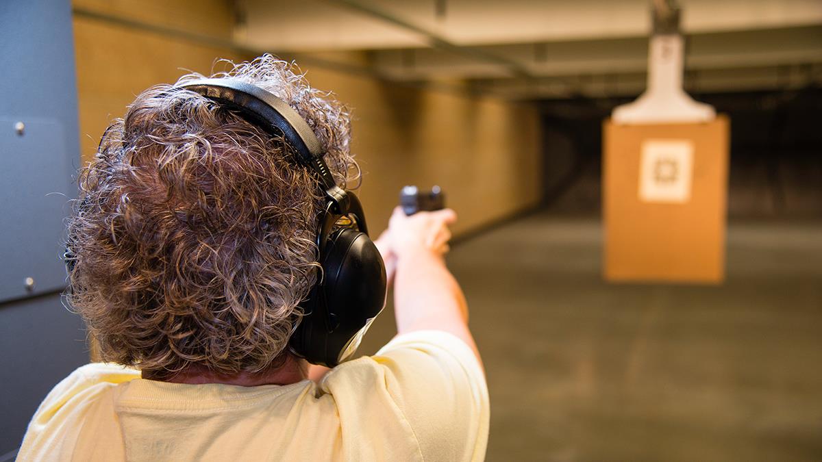 shooting pistol on firearm range