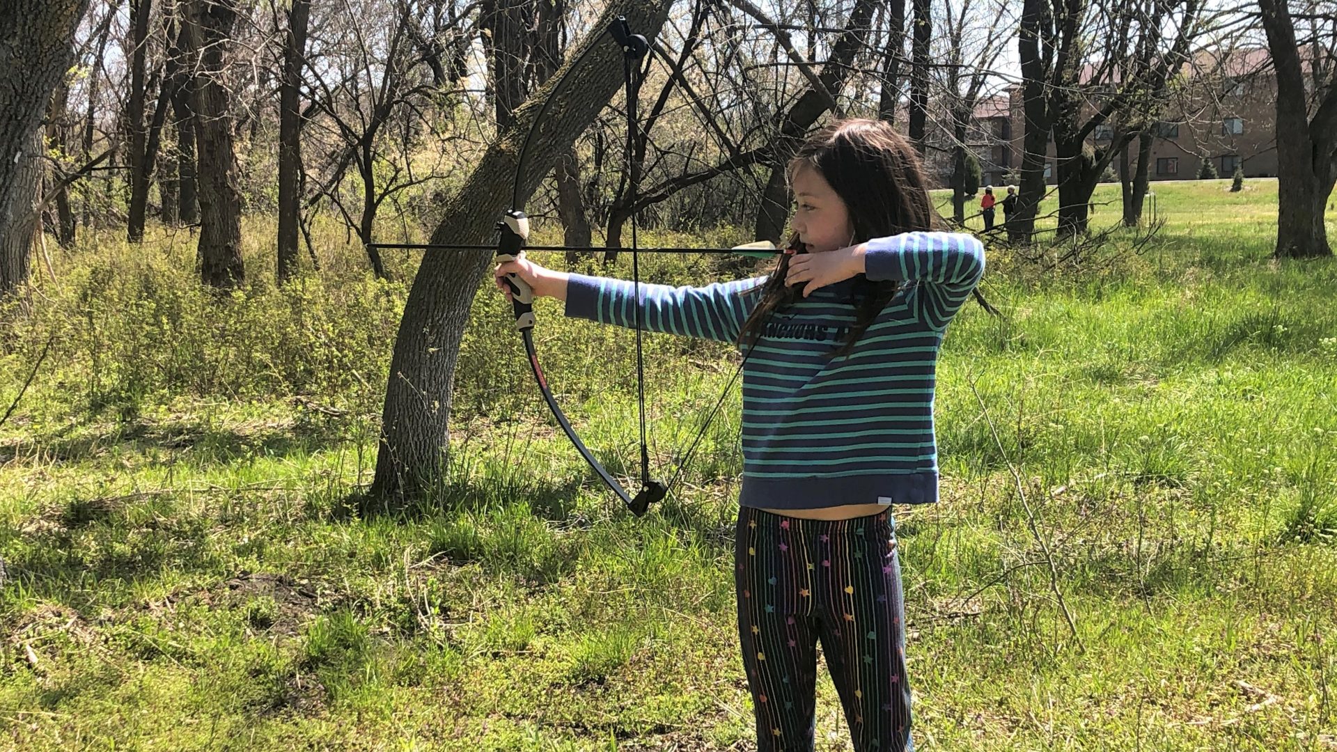 young archer on the field course