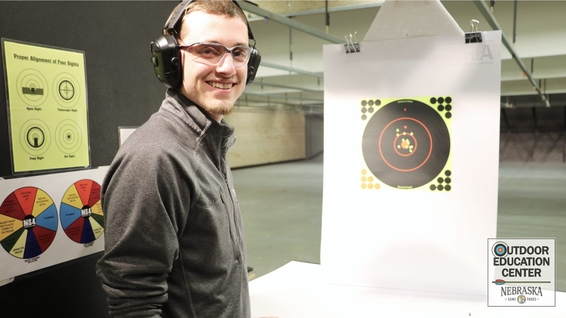 New shooter smiling with his target