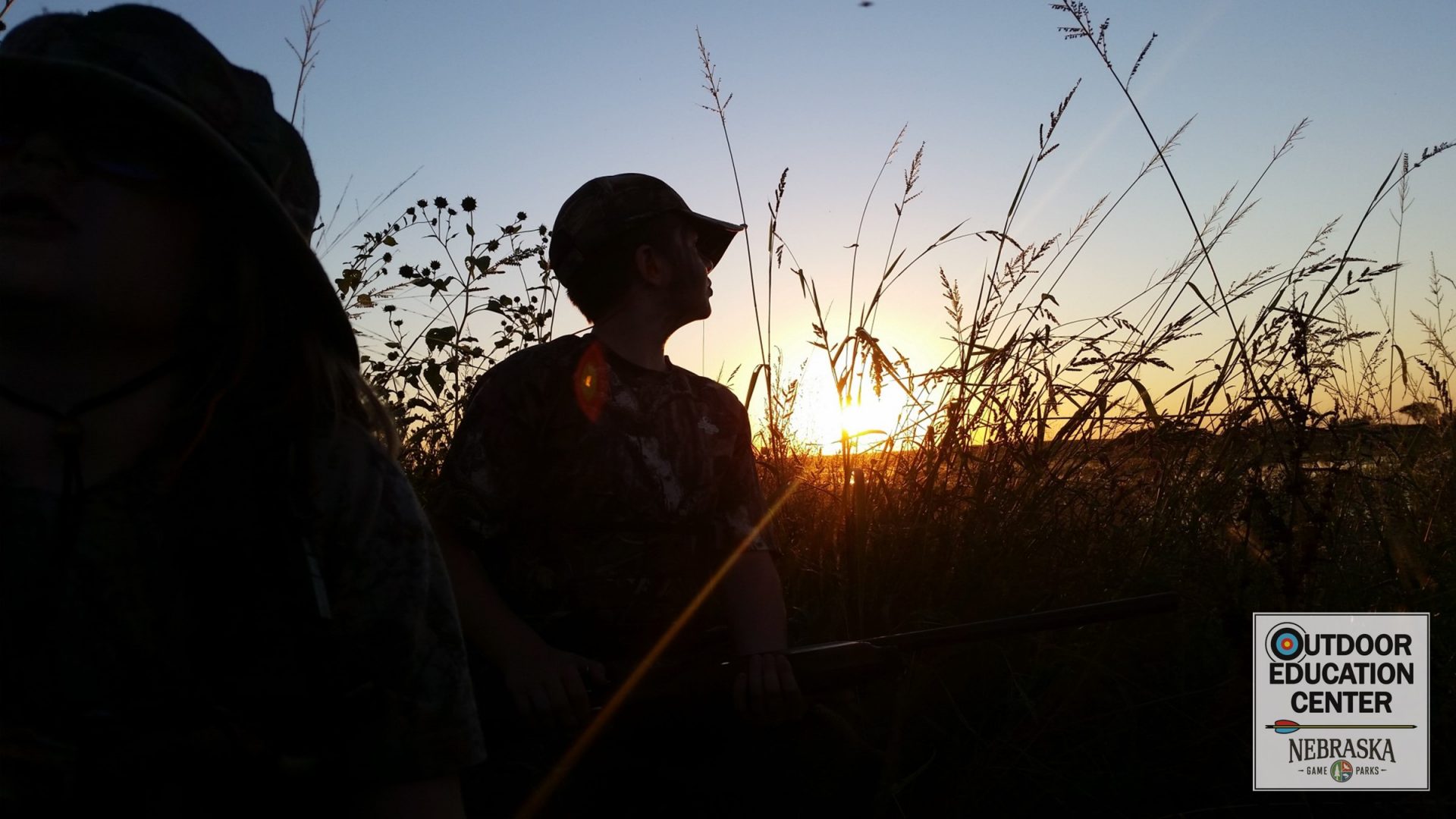 Young hunter at dawn silhouette