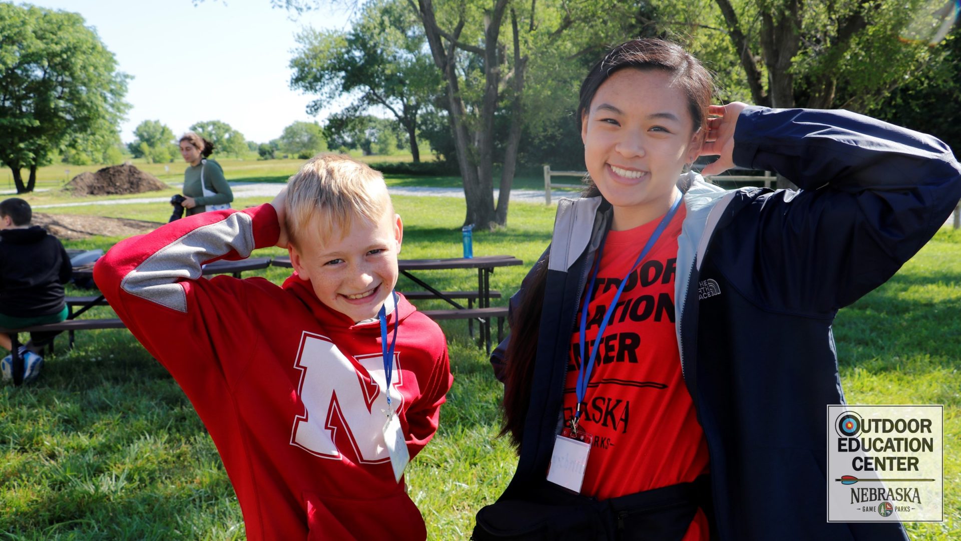 camper and counselor at the picnic tables