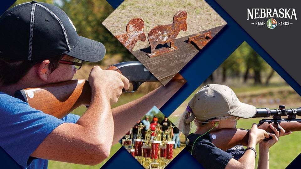 Youth shooting rifles from a standing position; metal silhouette targets