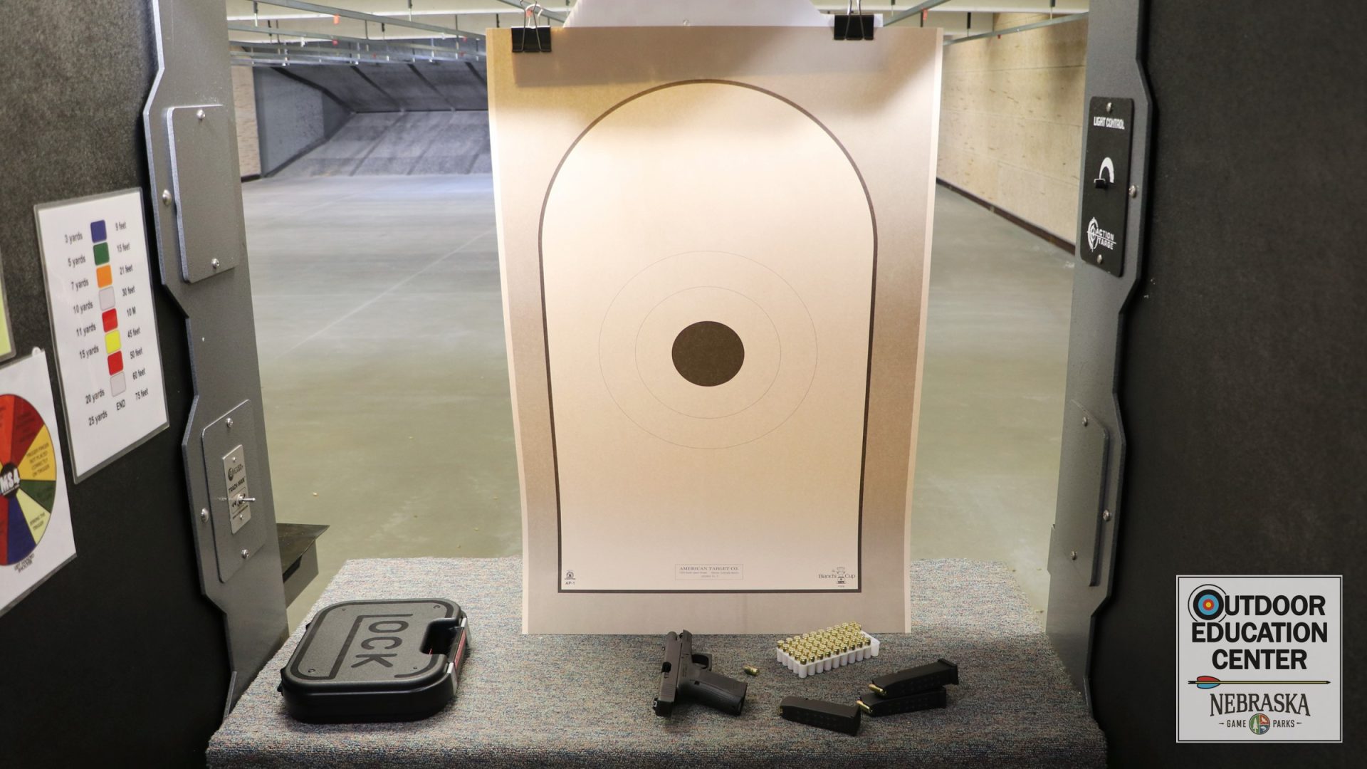 AP-1 target with unloaded pistol on bench
