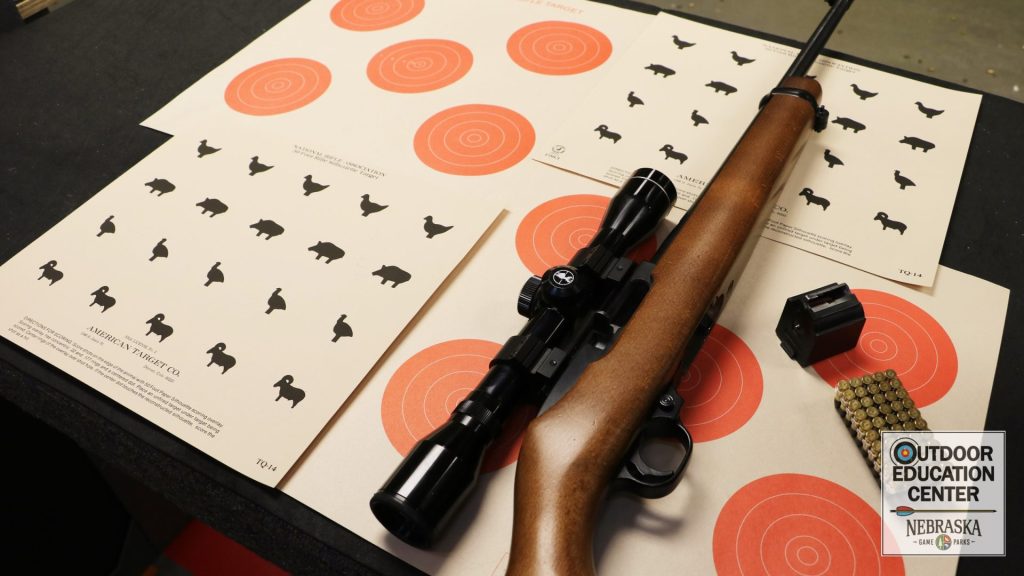 Unloaded .22 semi-auto rifle with variety targets