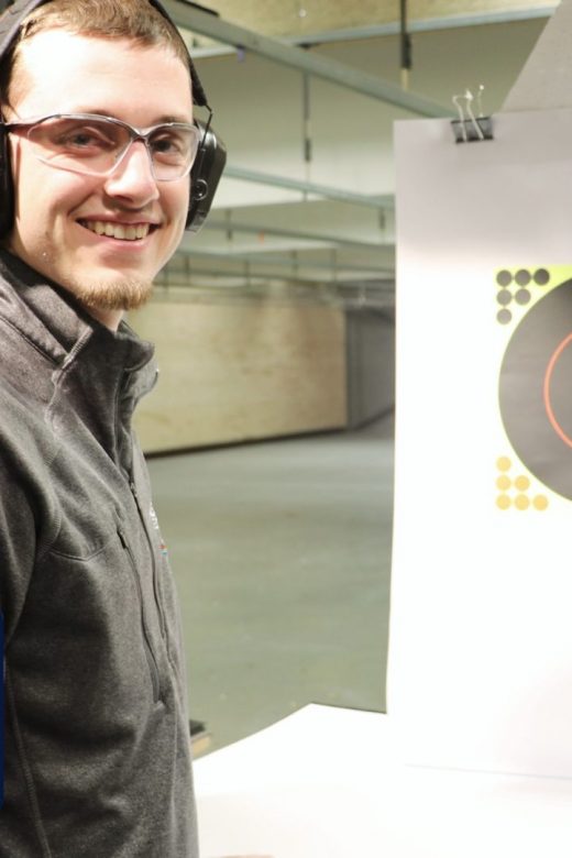 New shooter smiling with his target