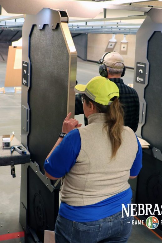 Range Safety Officer interacts with customer in firearm range