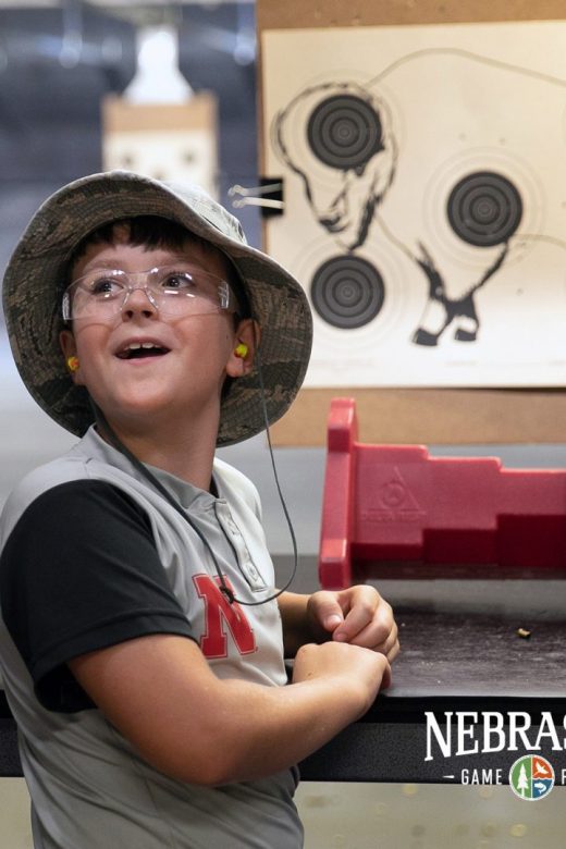 Boy expressing wonder at hitting target