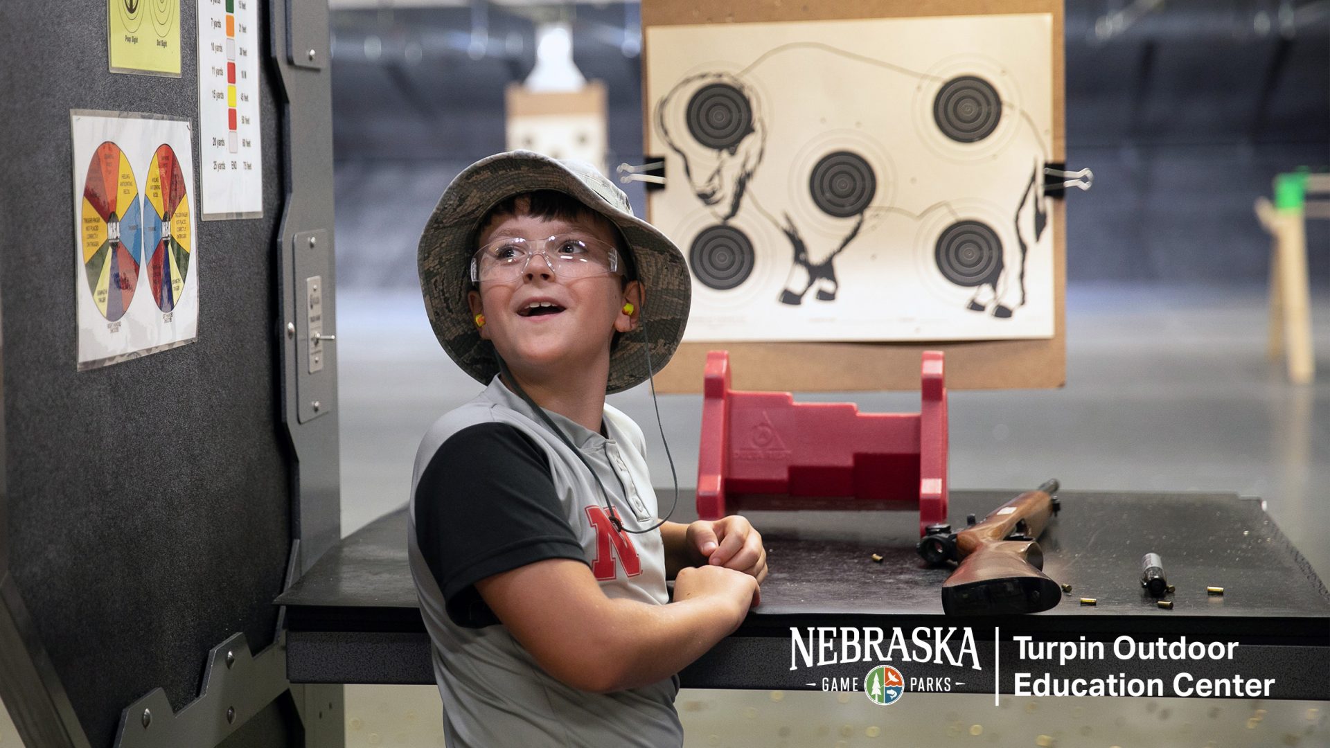 Boy expressing wonder at hitting target