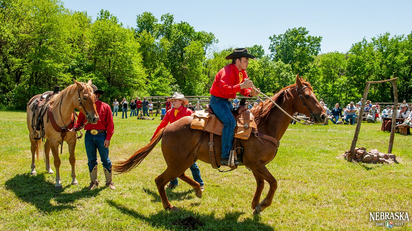 A historical reenactor rides a horse during the Pony Express Re-ride event.