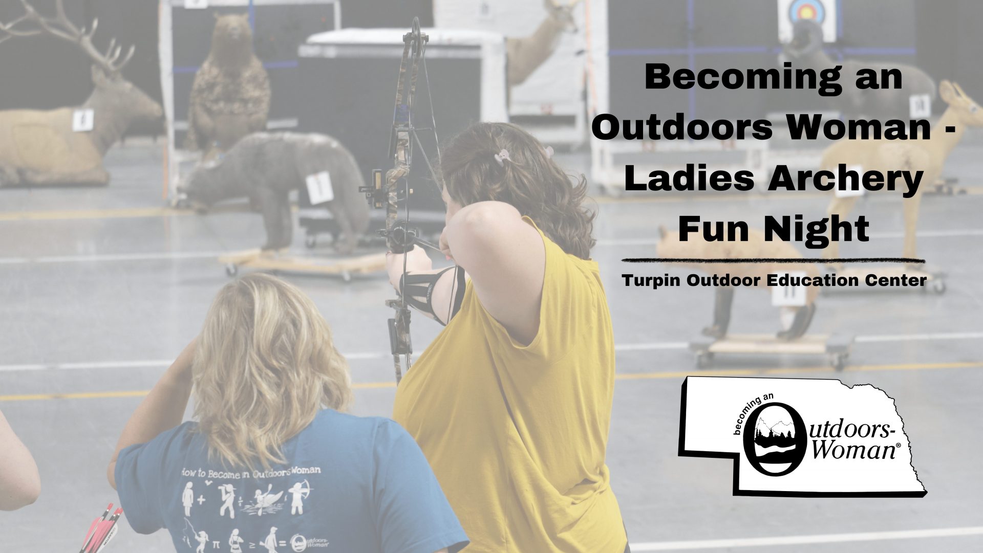 Women practice archery at the Turpin Outdoor Education Center's indoor range.