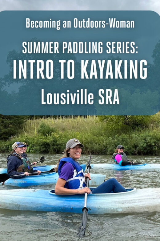 Women kayak on a river during spring.