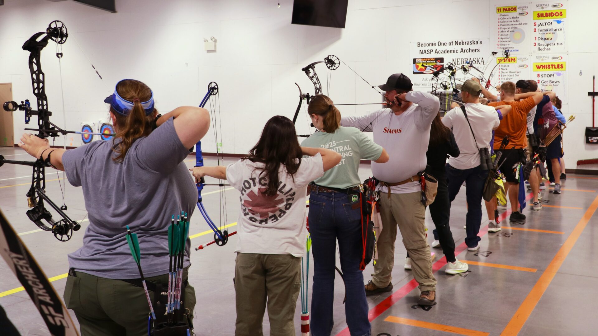 People shoot archery at the Turpin Outdoor Education Center.