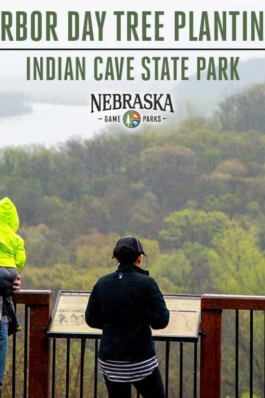 People stand on the scenic river and forest overlook on a misty day at Indian Cave State Park