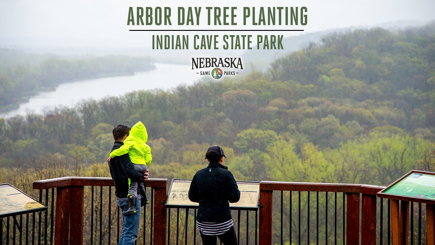 People stand on the scenic river and forest overlook on a misty day at Indian Cave State Park