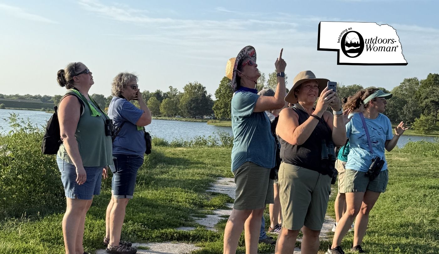 A group of women birding at a park.