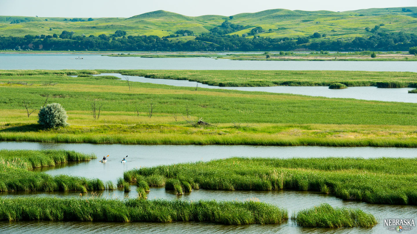 Scenic overlook of people kayaking in the Niobrara confluence during summer.