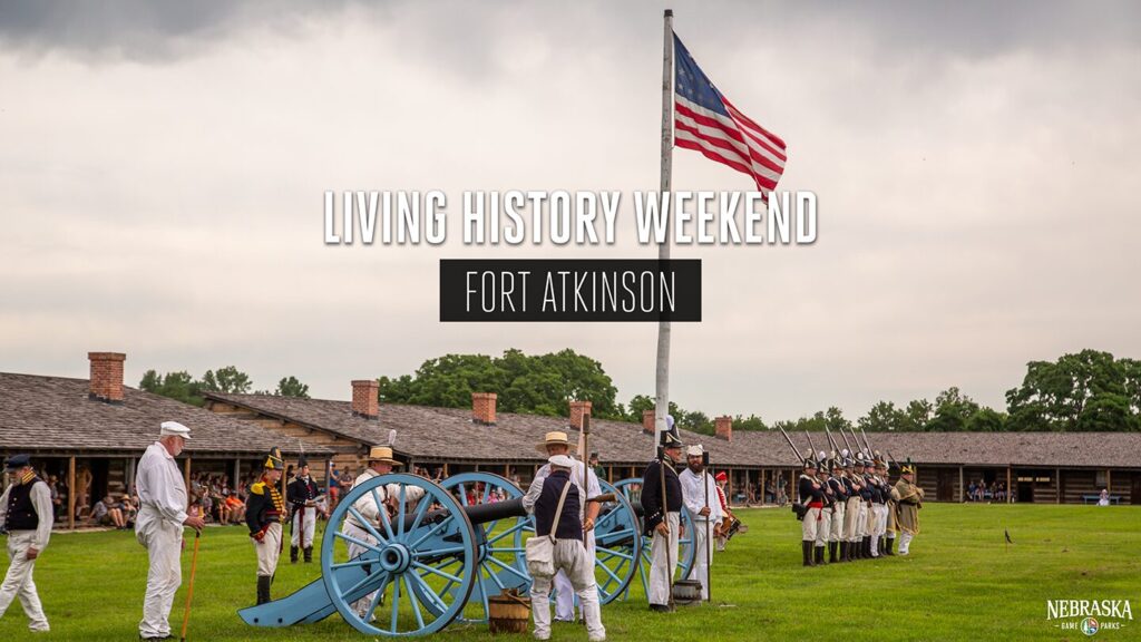 Historical reenactors light a canon at Fort Atkinson State Historical Park.
