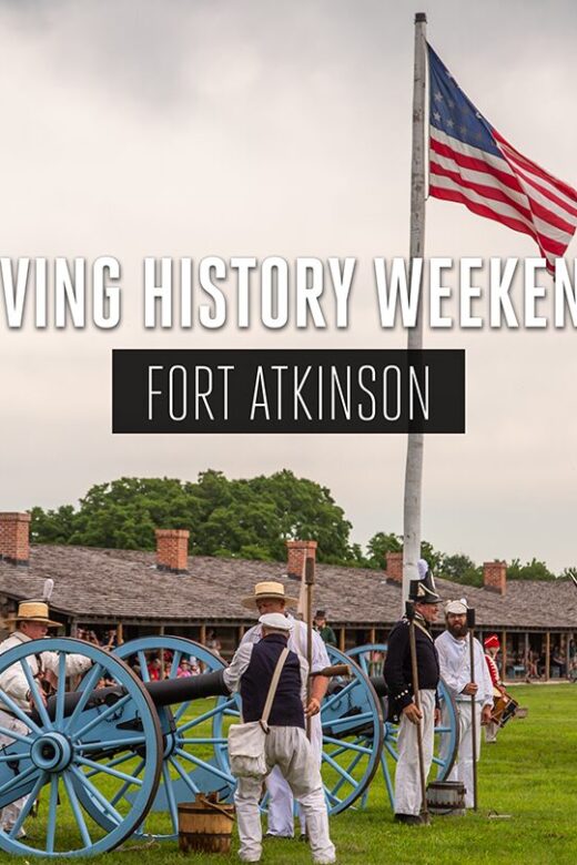 Historical reenactors light a canon at Fort Atkinson State Historical Park.