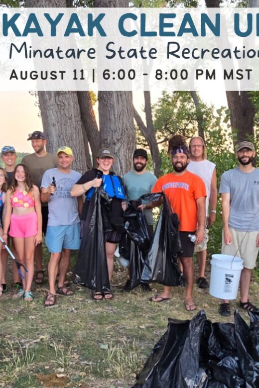 A group of people pose with trash they picked up during a kayak cleanup at Lake Minatare.