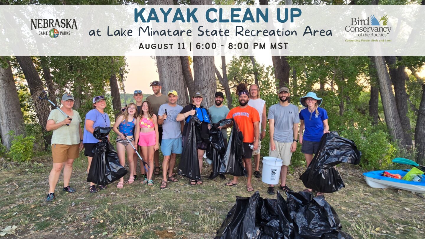 A group of people pose with trash they picked up during a kayak cleanup at Lake Minatare.
