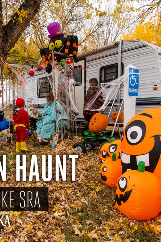 A campsite is decorated for Halloween in the fall as trick or treaters visit the camper.