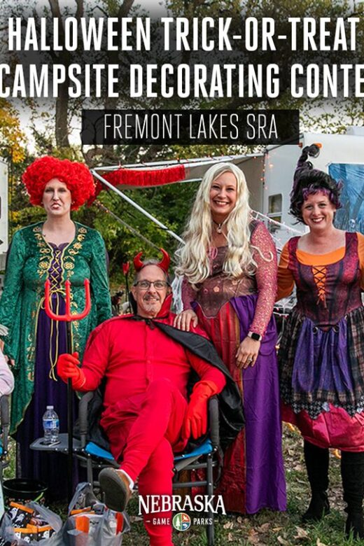 People dressed like the cast of Hocus Pocus pose for a photo at a state park.