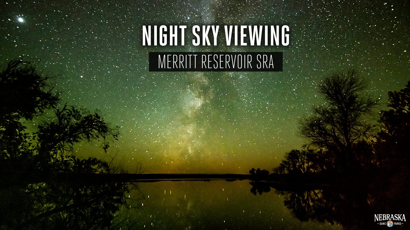 The Milky Way glows above Merritt Reservoir on a clear night.