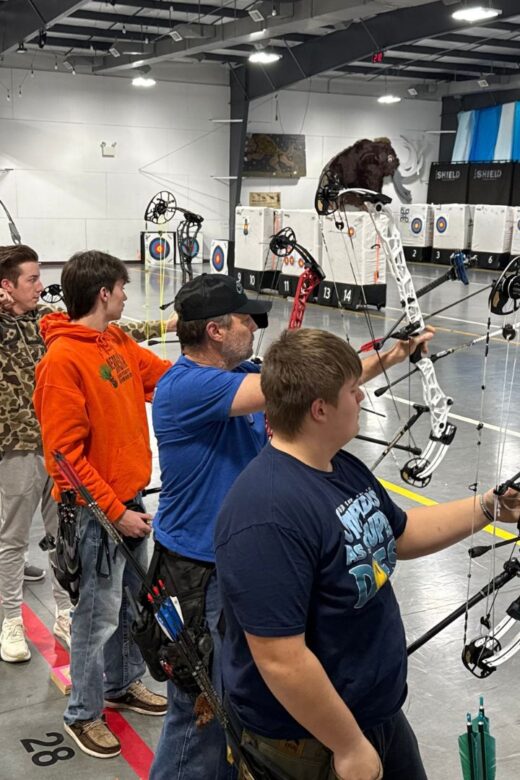 Archers shooting indoors