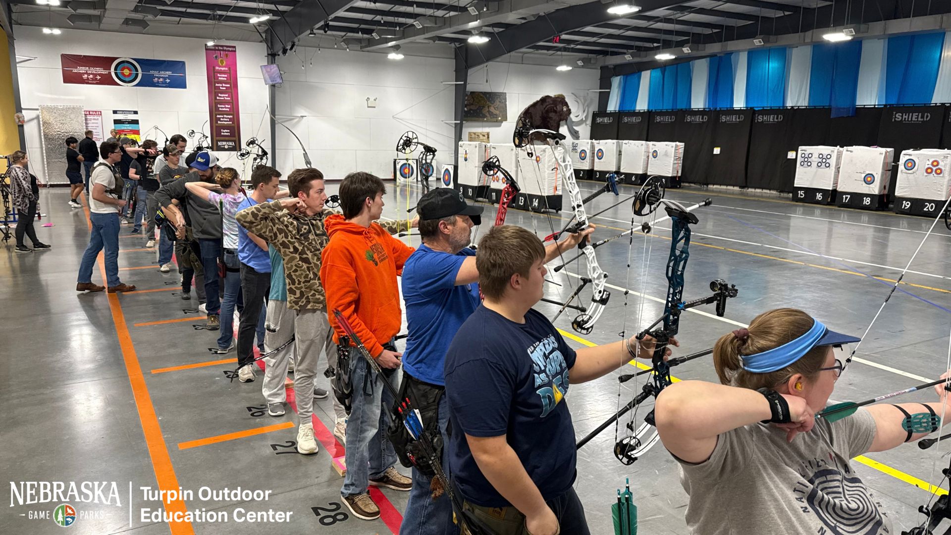 Archers shooting indoors