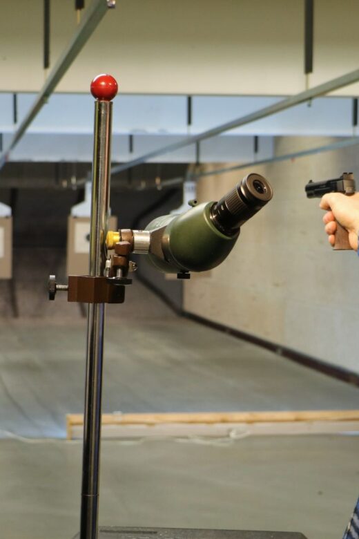 Man shooting a pistol on the firearm range