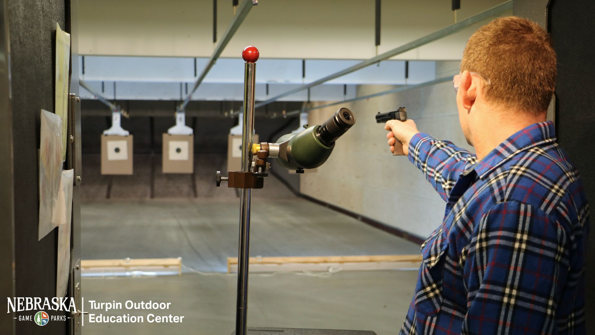 Man shooting a pistol on the firearm range